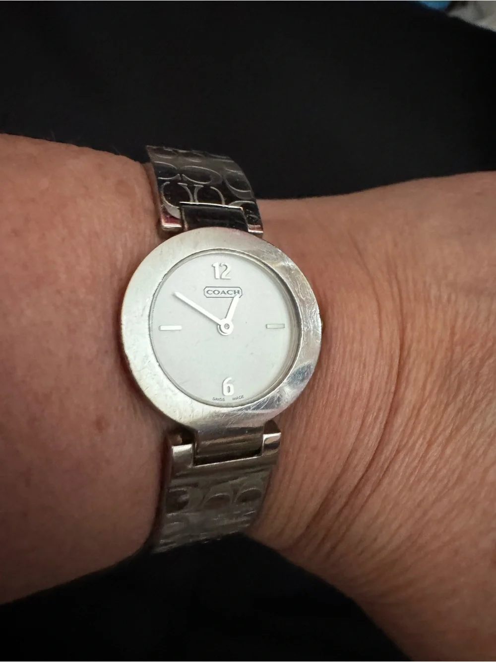 Coach polished silver
